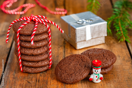 Chocolate cookies, gift, snowman and Christmas tree branches