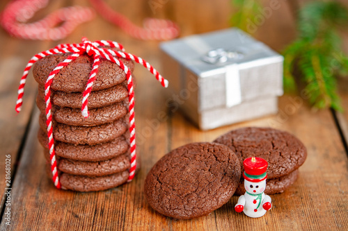 Chocolate cookies, gift, snowman and Christmas tree branches