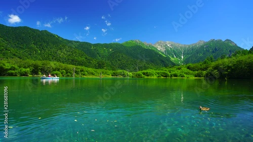 Panning wide shot of Taisho pond and Mount Hotaka,  Japan photo