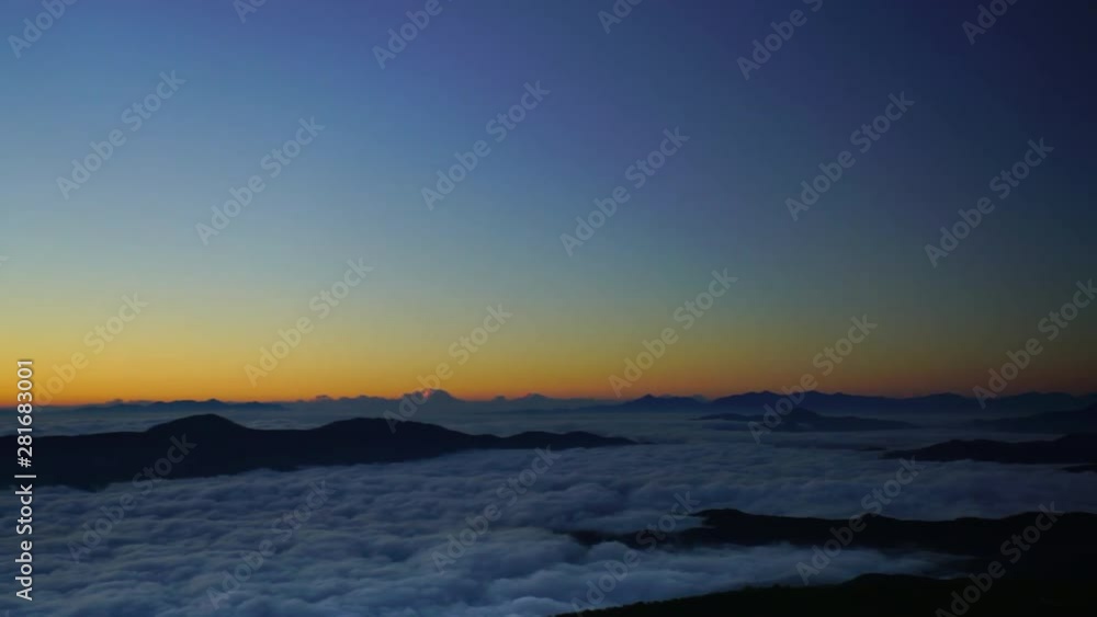 Panning shot of Mount Kaikoma in clouds at sunrise, Japan Panning shot of Mount Kaikoma in clouds at sunrise, Japan