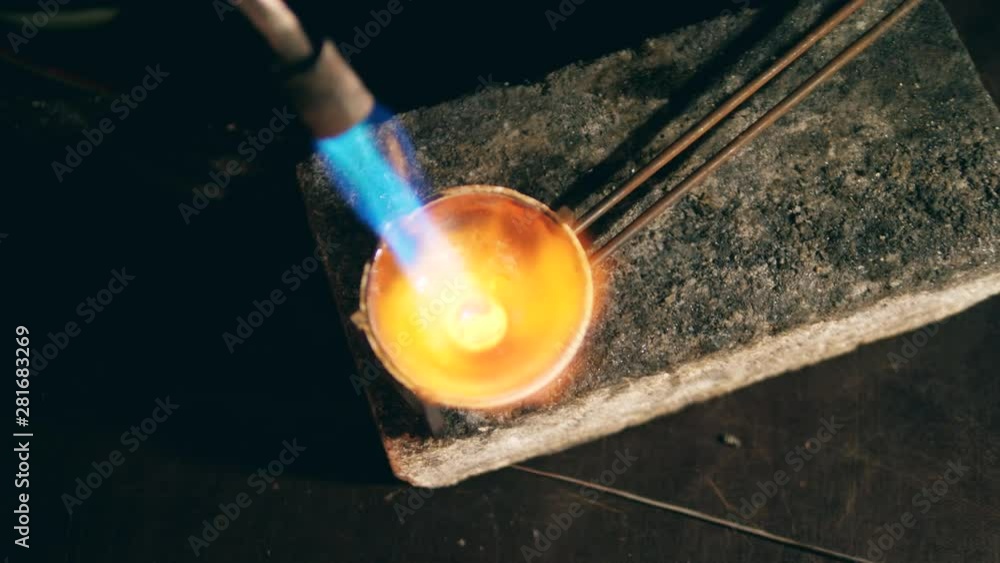 Process of metal melting with a burner at a jewellery Stock Video Adobe Stock