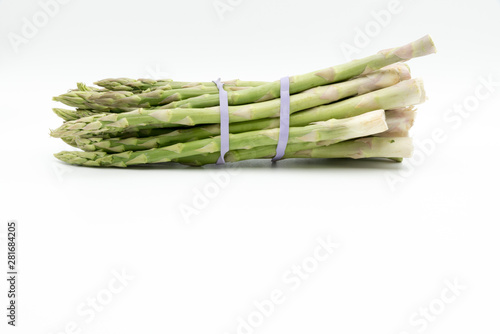 Asparagus surrounded by a medical tape on weighing scale for diets