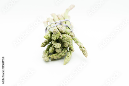 Asparagus surrounded by a medical tape on weighing scale for diets