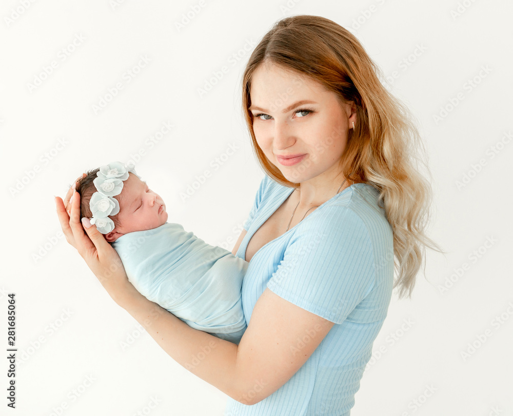 young beautiful mother holding a newborn daughter young beautiful mother holding a newborn daughter
