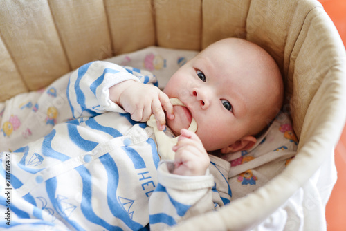 baby with teether toy