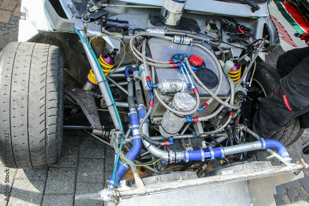 A detail of the sports car engine. It is a historic group B rallye car from the past. A detail of the sports car engine. It is a historic group B rallye car from the past.
