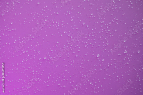 Raindrops on a purple background.