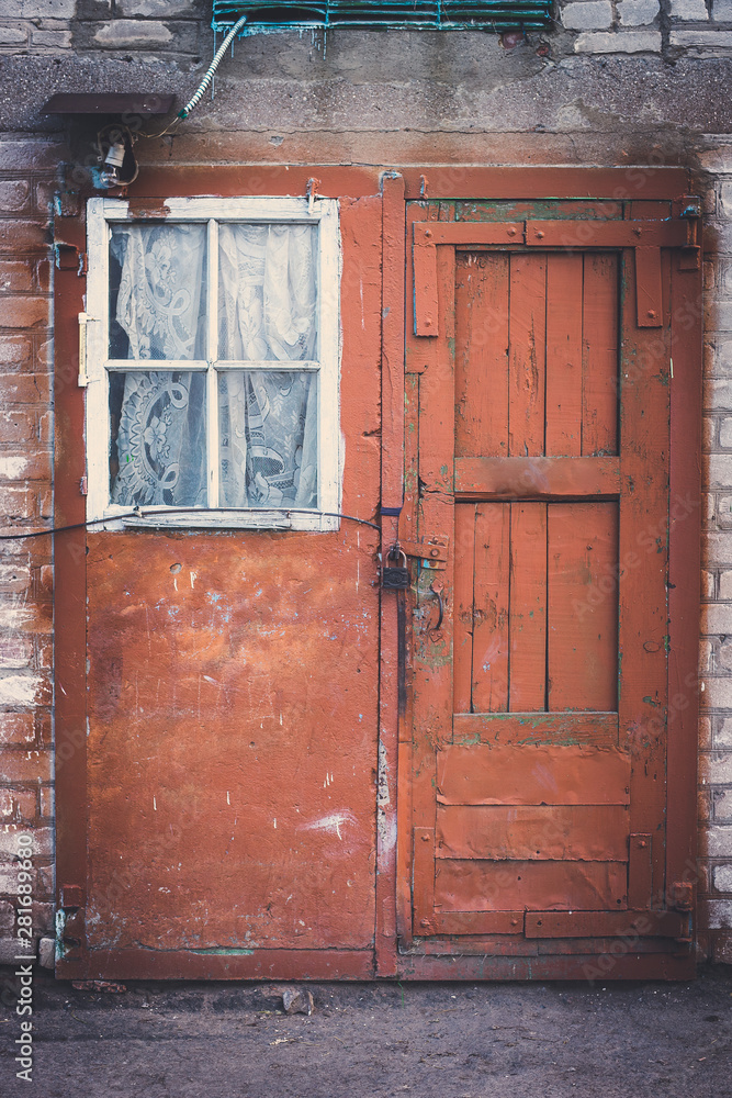 Facade of an old building with door and window Facade of an old building with door and window
