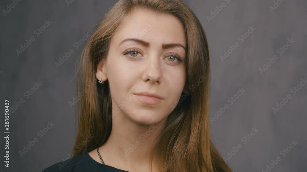 Portrait of an attractive girl close-up. Green eyes. Slow motion. 4k Portrait of an attractive girl close-up. Green eyes. Slow motion. 4k