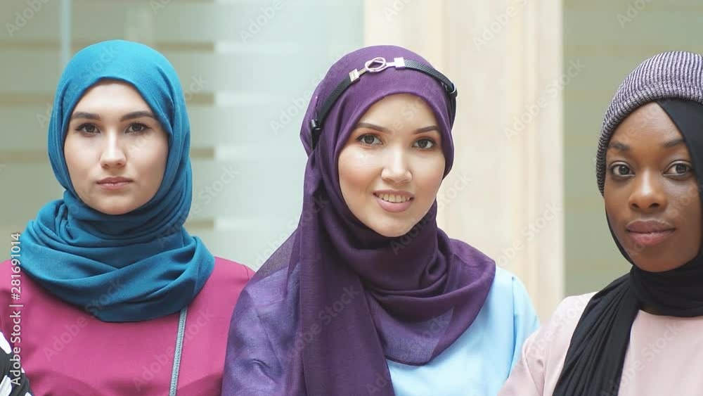Portrait of multiracial group of muslim women dressed in national ...