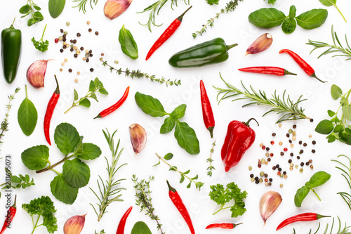 Spice herbal leaves and chili pepper on white background. Vegetables pattern. Floral and vegetables on white background. Top view, flat lay. © gitusik