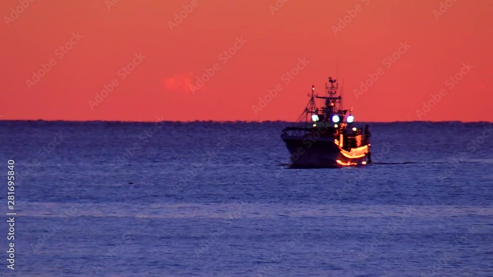 Fishing boat in Pacific Ocean at sunrise, Erimo, Hokkaido, Japan Fishing boat in Pacific Ocean at sunrise, Erimo, Hokkaido, Japan