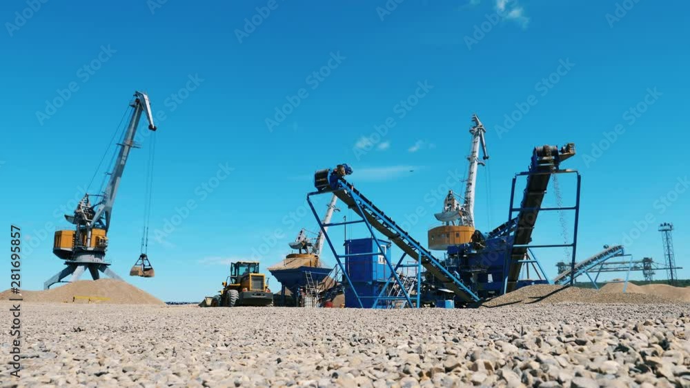 Mineral extraction site with industrial loaders Mineral extraction site with industrial loaders