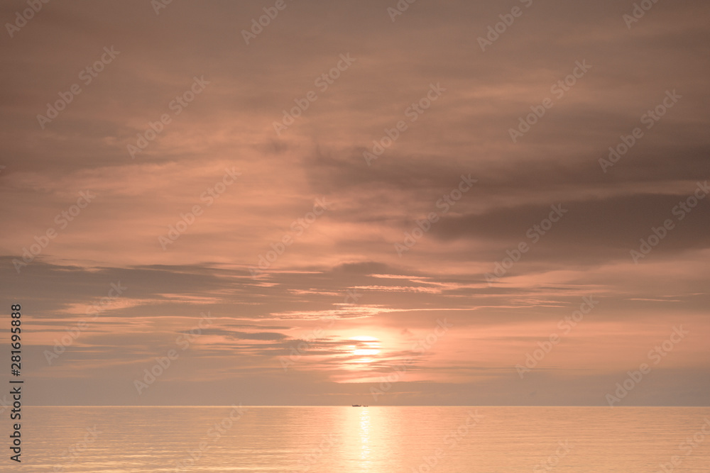 Fishermen boat silhouette against orange sunrise on Lake Malawi, the sun glitter on the Lake, South-East-Africa Fishermen boat silhouette against orange sunrise on Lake Malawi, the sun glitter on the Lake, South-East-Africa