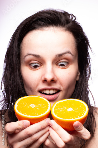 beautiful girl with oranges smiling