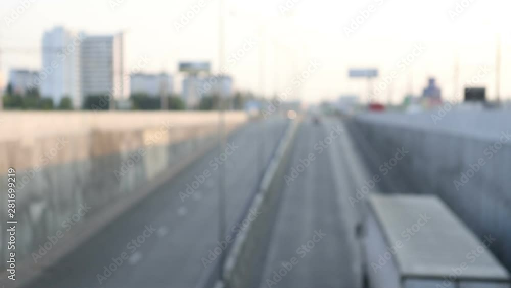 view of urban car traffic early in the morning, defocus makes beautiful bokeh from the included headlights, general plan view of urban car traffic early in the morning, defocus makes beautiful bokeh from the included headlights, general plan