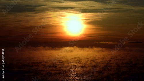View of sunrise over sea, Taiki, Hokkaido, Japan photo