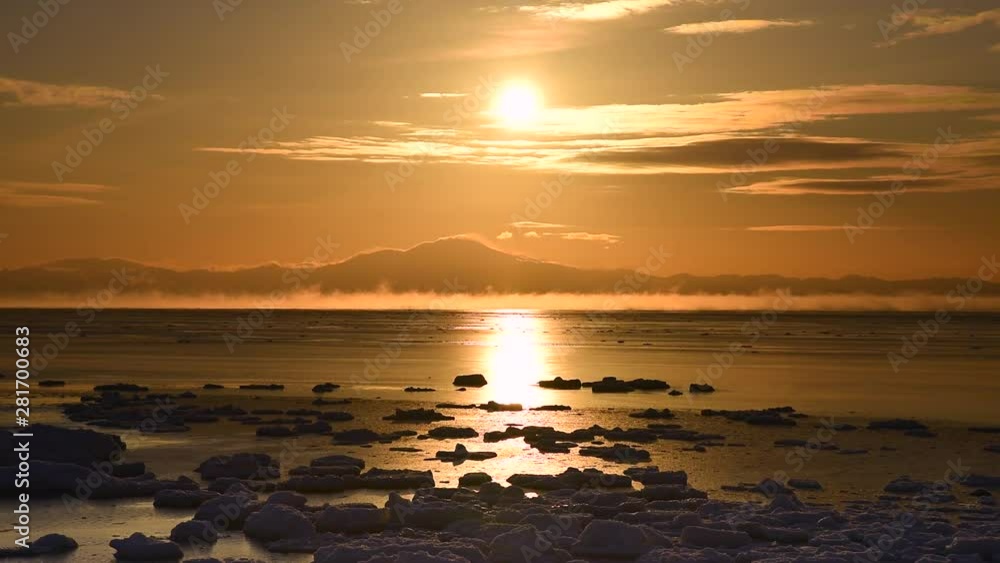 Ice floe in Sea of Okhotsk in winter at sunrise, Hokkaido, Japan Ice floe in Sea of Okhotsk in winter at sunrise, Hokkaido, Japan