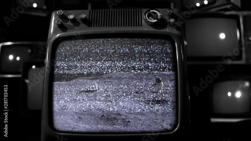 Apollo 16 Mission, Astronauts Driving Rover On the Moon, Seen On a Retro TV. Black and White Tone. Elements of this image furnished by Nasa.  photo