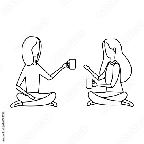businesswomen drinking coffee seated in lotus position