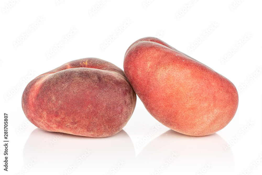 Group of two whole fresh red peach prunus persica platycarpa isolated on white background Group of two whole fresh red peach prunus persica platycarpa isolated on white background
