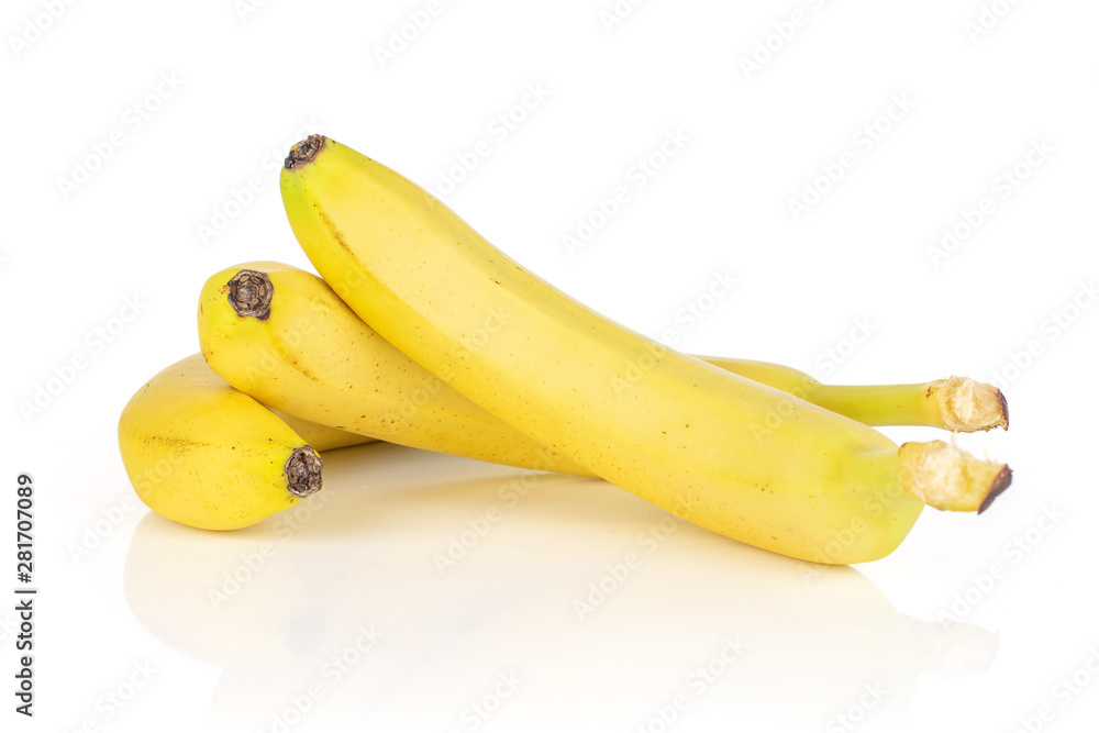 Group of three whole ripe yellow banana isolated on white background Group of three whole ripe yellow banana isolated on white background