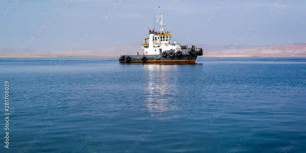 Boat at pier in Paracas bay in Ica, Peru