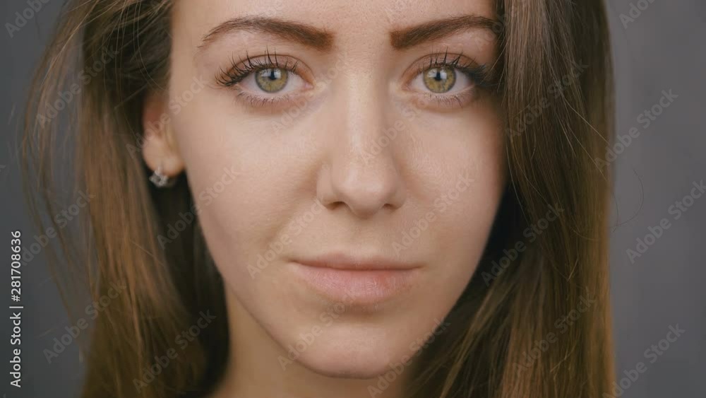 Close-up portrait of an attractive girl. Green eyes. Slow motion. 4k Close-up portrait of an attractive girl. Green eyes. Slow motion. 4k