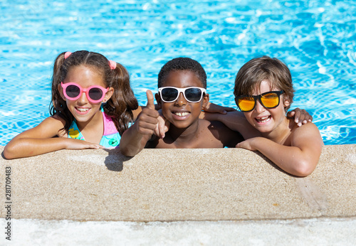 kids smiling and happy at the pool