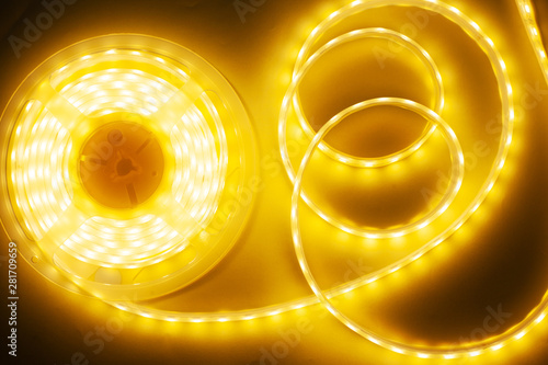 bright yellow LED strip, diode strip, a coil  of silicone strip photo