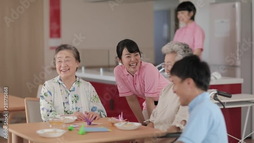 Wallpaper Mural Caregivers talking to patients in nursing home canteen Torontodigital.ca