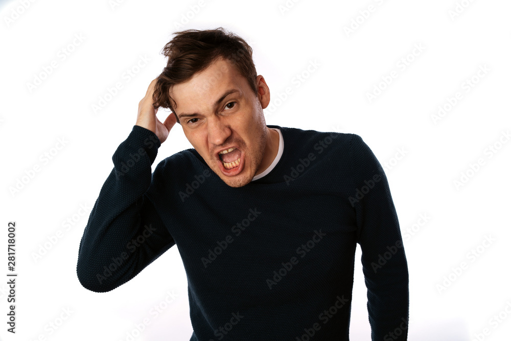 emotional portrait of a crazy man in close-up. concept: the nervous breakdown, mental disease, headaches and migraine. isolated on white background. emotional portrait of a crazy man in close-up. concept: the nervous breakdown, mental disease, headaches and migraine. isolated on white background.