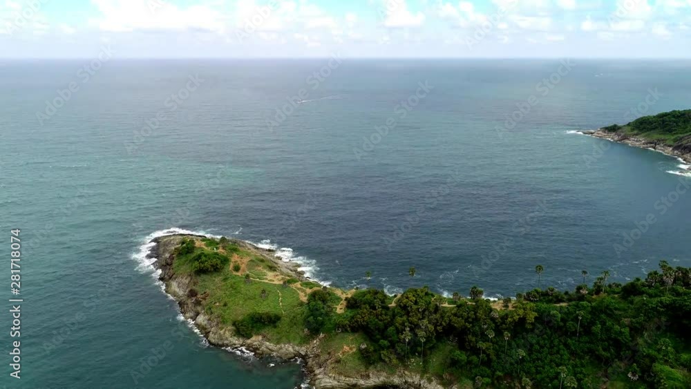 Aerial Drone Hyperlapse of Laem Phromthep viewpoint Beautiful tropical sea and clear blue sky white clouds in summer season at phuket island 4k time lapse footage Aerial Drone Hyperlapse of Laem Phromthep viewpoint Beautiful tropical sea and clear blue sky white clouds in summer season at phuket island 4k time lapse footage