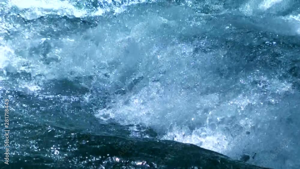 Slow motion of blue splashing water of Akan River Slow motion of blue splashing water of Akan River