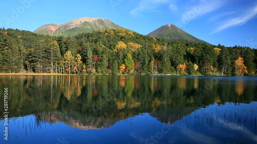Lake Onetto and autumn forest surrounding Mount Meakan and Akan Fuji photo