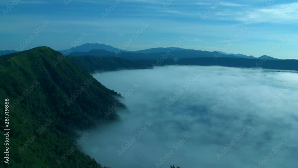 View of mountains with flowing clouds View of mountains with flowing clouds