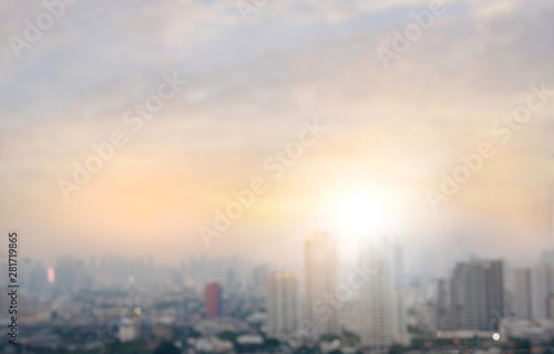 Blurred images of the sky and beautiful city buildings during sunrise.