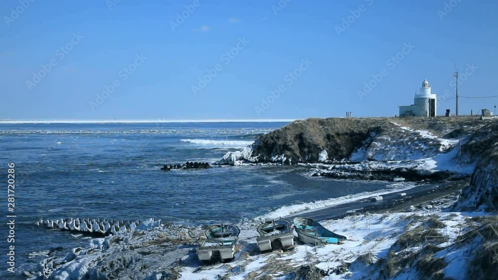 View of lighthouse on coastline in winter, Nemuro, Hokkaido, Japan View of lighthouse on coastline in winter, Nemuro, Hokkaido, Japan