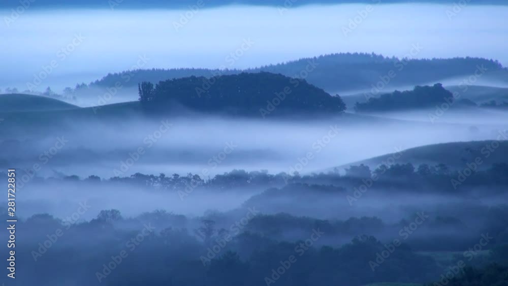 Timelapse of fog flowing over forested hills Timelapse of fog flowing over forested hills