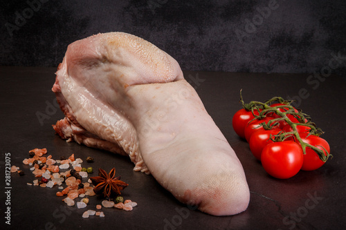 closeup cow tongue served with spices and tomatoes cherry