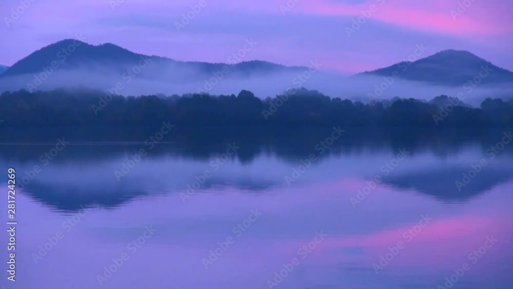 Zoom out of forest reflecting in Lake Sasahara at sunrise, Japan Zoom out of forest reflecting in Lake Sasahara at sunrise, Japan