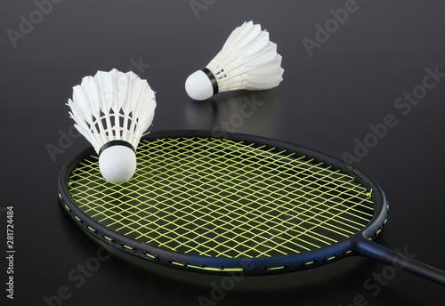 badminton racket and shuttlecock on strings
