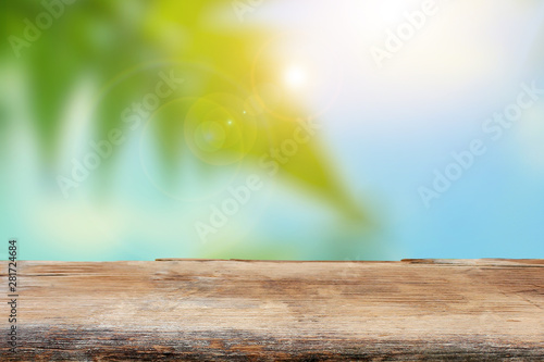 Empty wood plank table top with blur park green nature background bokeh light, Summer concept