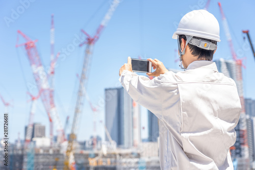 Naklejka asian engineer worker working in construction site