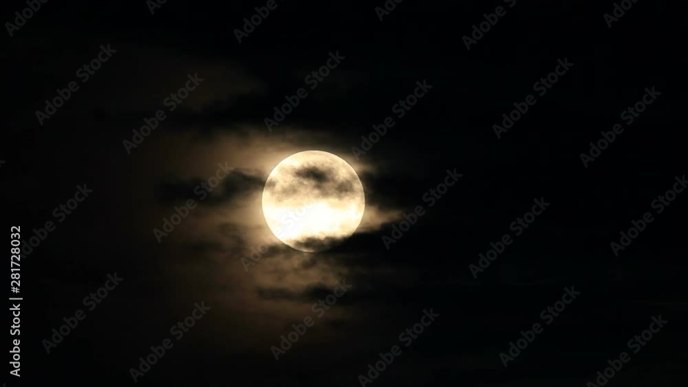 Full moon in night sky with flowing clouds Full moon in night sky with flowing clouds