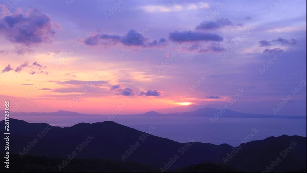 Timelapse of clouds flowing over mountains at sunrise Timelapse of clouds flowing over mountains at sunrise