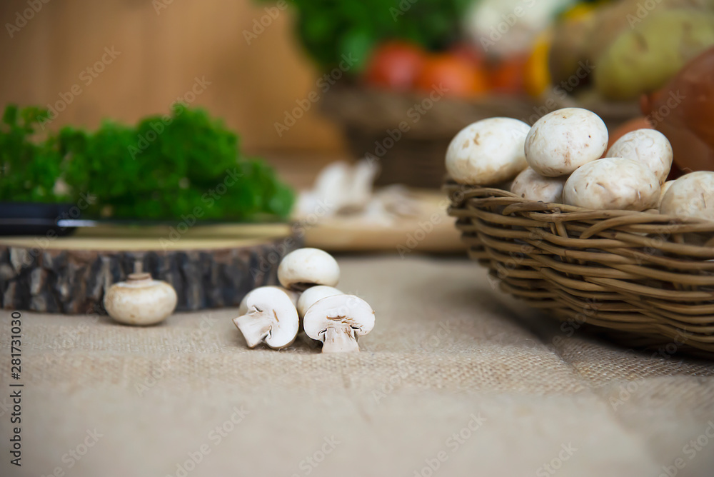 Fresh champignon mushroom vegetable in the kitchen - fresh mushroom vegetable cooking concept Fresh champignon mushroom vegetable in the kitchen - fresh mushroom vegetable cooking concept