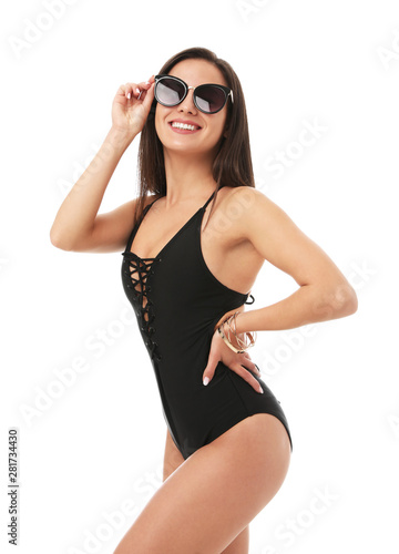 Pretty sexy woman with slim body in stylish black bikini on white background © New Africa