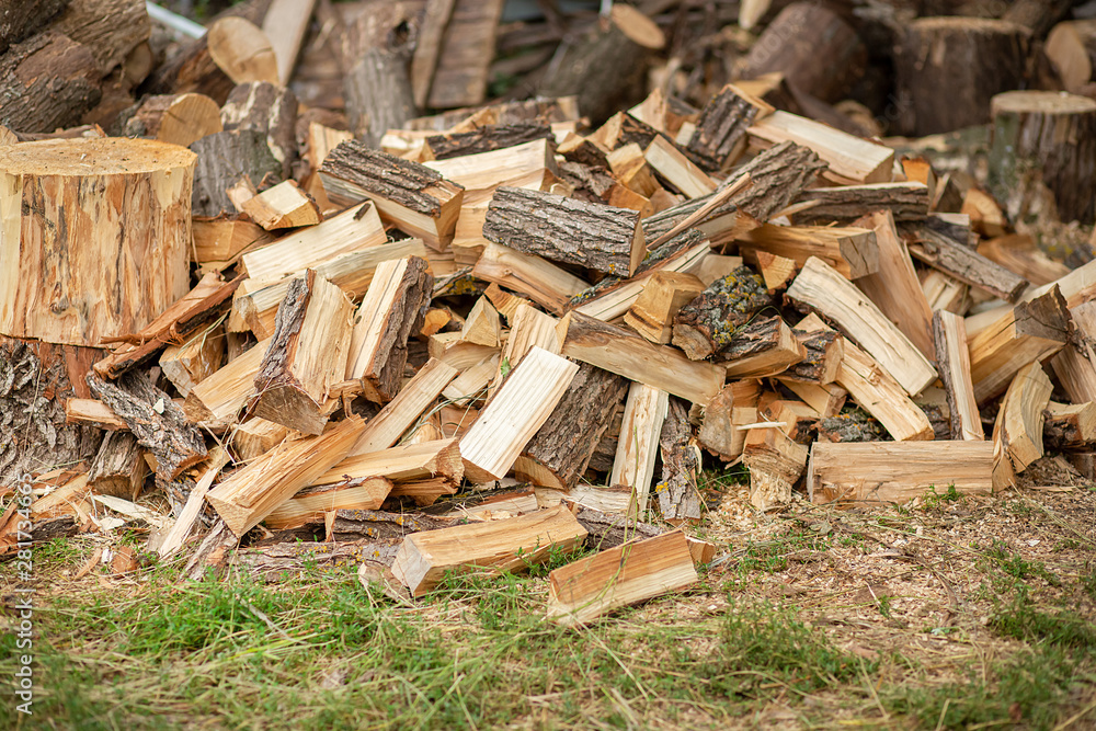 Natural wood decor background. A pile of chopped firewood prepared for winter. Natural wood decor background. A pile of chopped firewood prepared for winter.