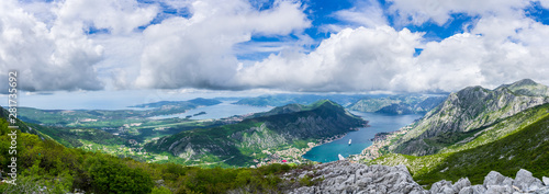 Montenegro, XXL panorama of azure waters of fjord in kotor bay with two cruise ships anchoring in harbor in spectacular nature landscape photo